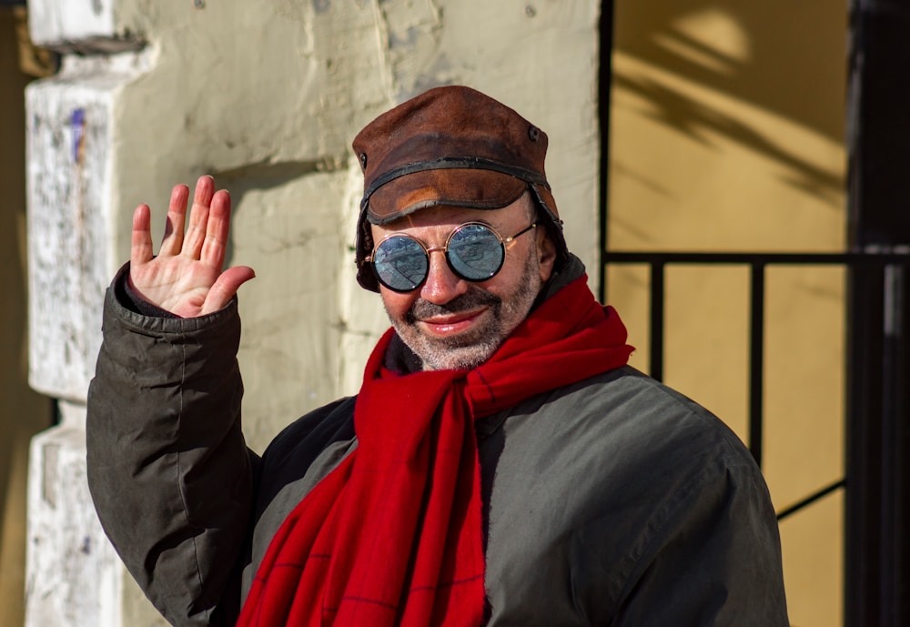 How to Choose the Right Men’s Scarf for Style, Comfort, and Warmth 1 man in black jacket wearing red scarf and black sunglasses