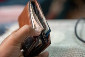 a person holding a wallet in their hand