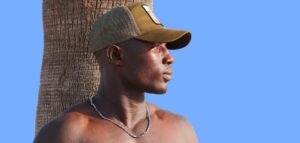 man wearing green and brown hat
