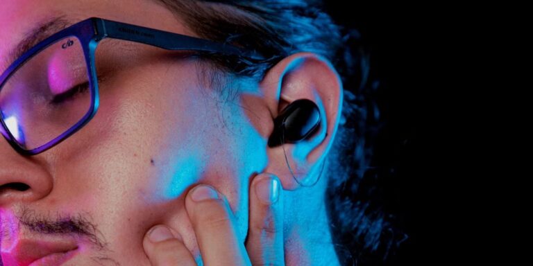 man sleeping with earbuds in 2