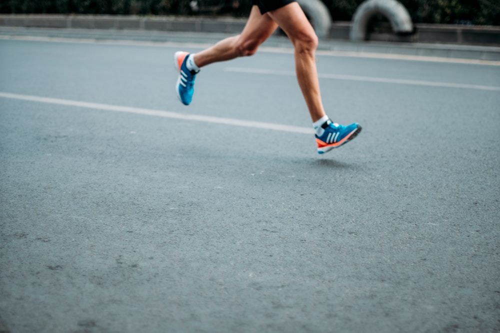The Best Running Shoes Available Today: Finding What Fits Your Run 1 pair of blue-and-white Adidas running shoes